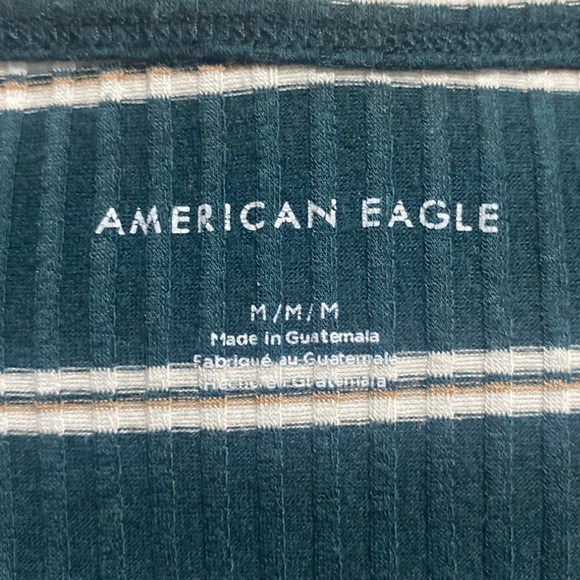 this is a very cute cropped green, striped American eagle shirt. - Picture 3 of 4